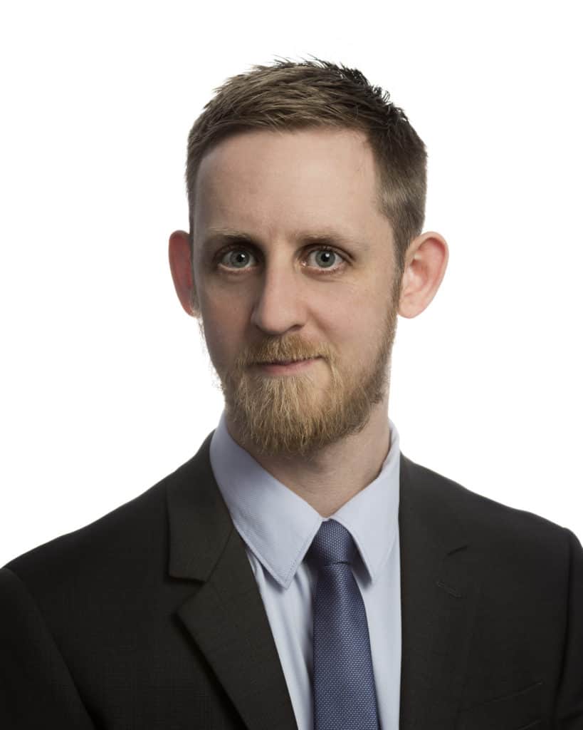 Portrait of Patrick Flynn. Dashing. Handsome. Perceptively humble.
